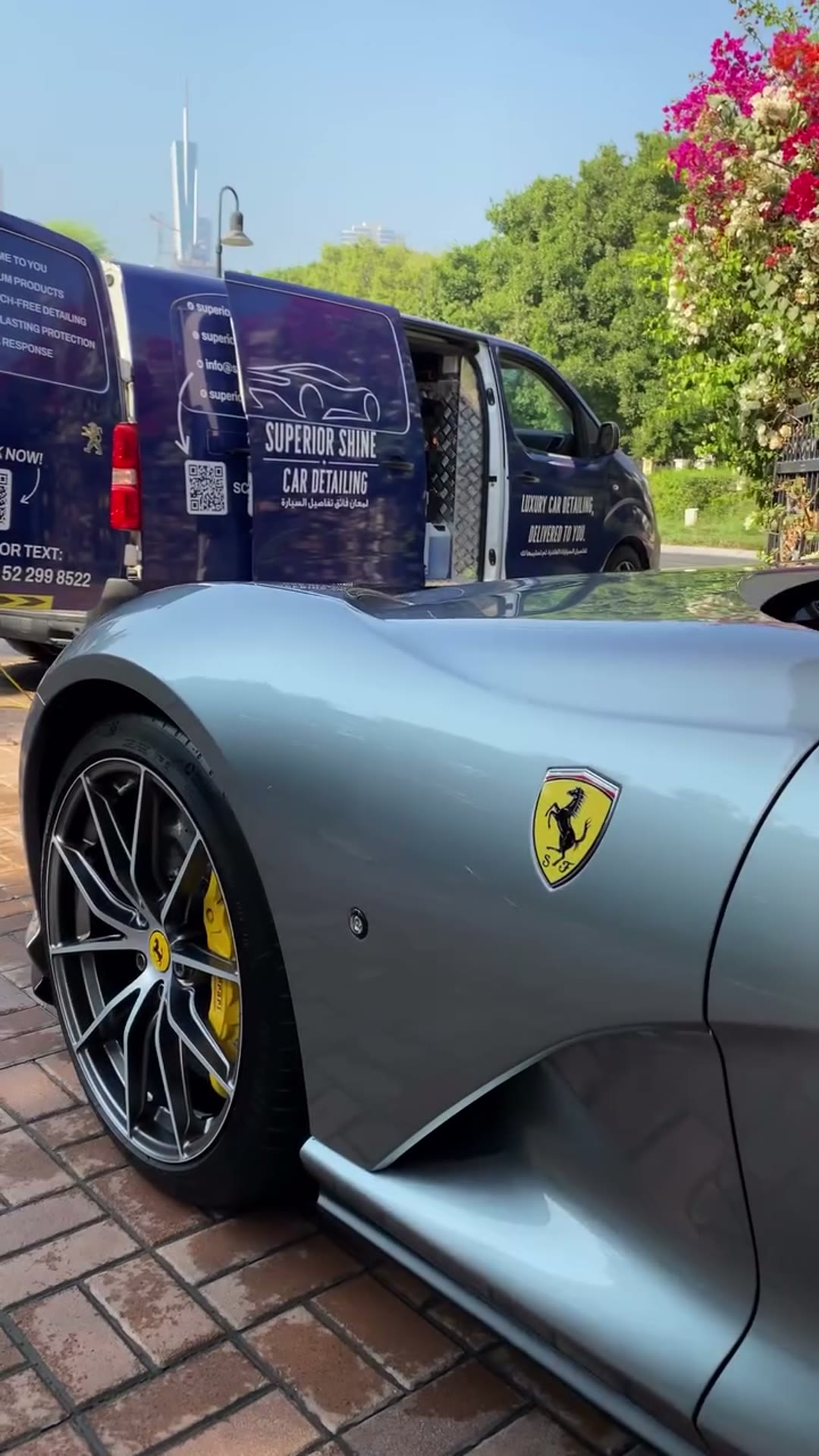 Silver Ferrari beside the Superior Shine mobile detailing van
