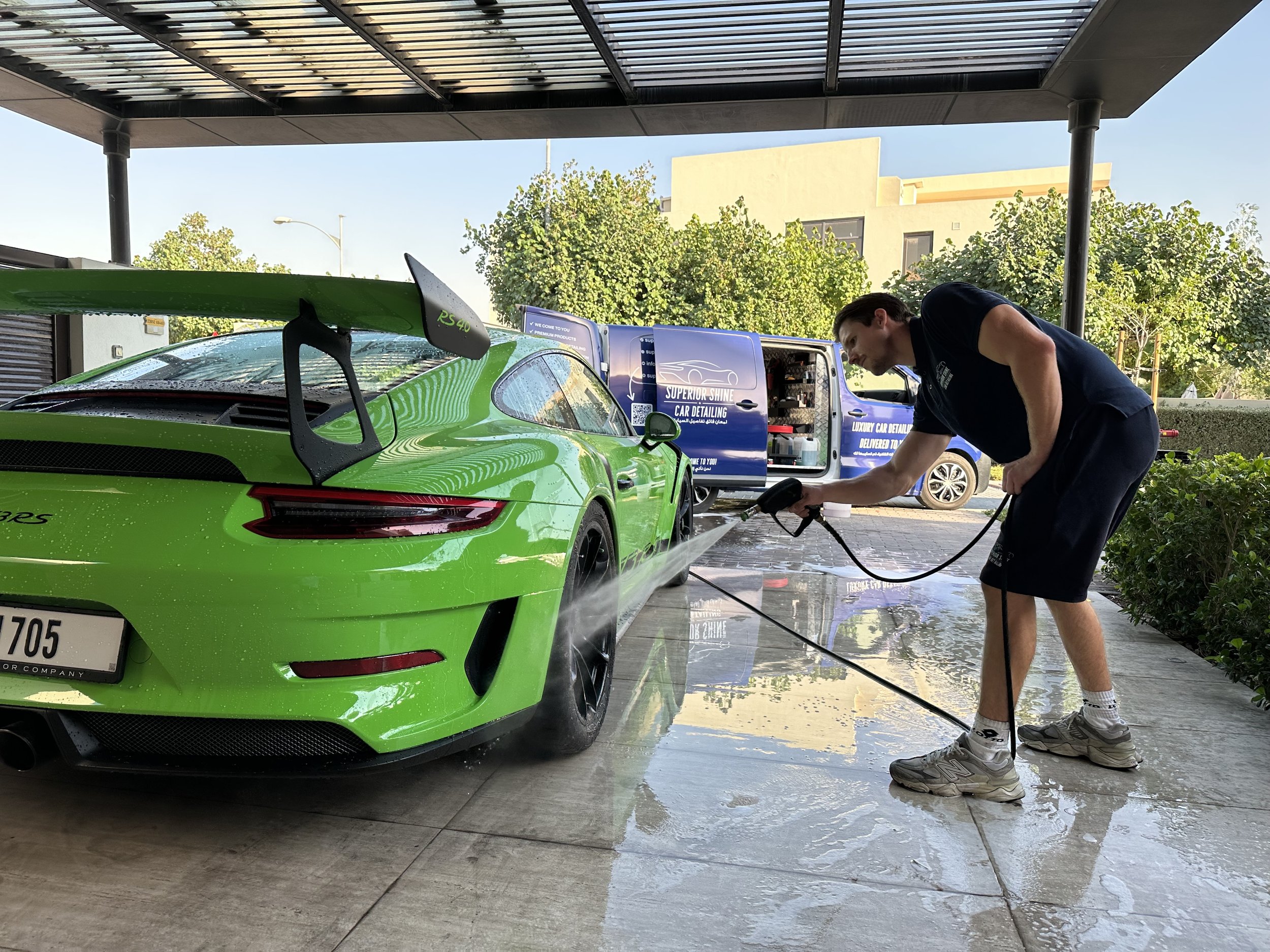 Superior Shine Car Detailing owner beside the mobile detailing van in Dubai